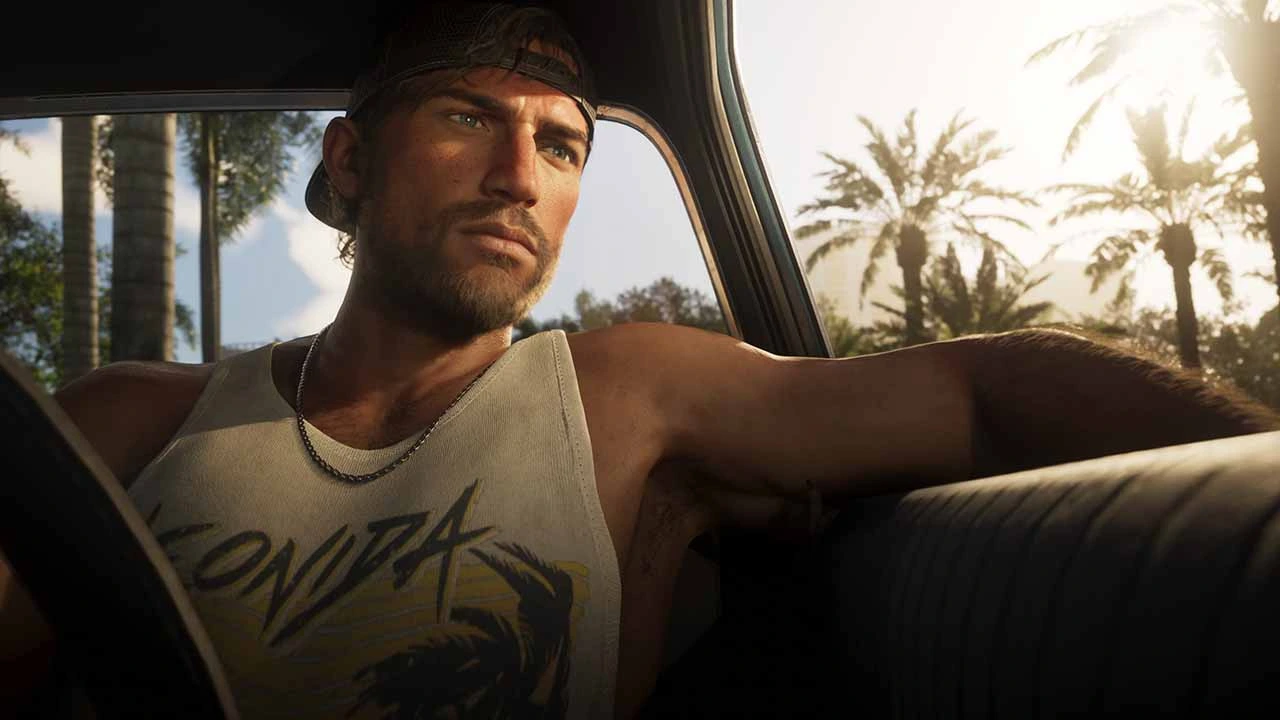 GTA 6 Ana karakter Jason Duval arabada elini camdan dışarıya atmış.